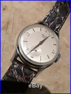 Ancienne montre mécanique Record Watch Genève homme incabloc