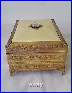 Boîte à bijoux musicaux antiques décorative or doré métal design floral suisse