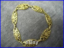 Bracelet ancien Art Nouveau années 20 volutes fleurs en or 18 carats
