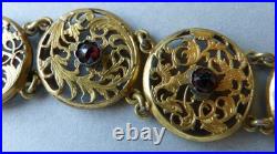 Bracelet ancien en coq de montre à gousset et pierres rouges