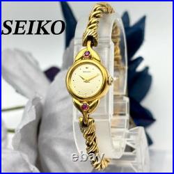Élégante montre pour femme SEIKO ton or quartz bijoux analogiques style ancien