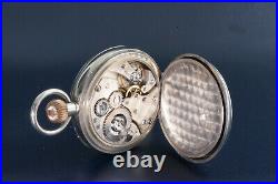 Montre de poche vintage antique 8 jours en acier de fabrication suisse dans un étui en argent vers 1900