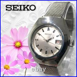 Montre mécanique SEIKO Shario 21 bijoux 3 aiguilles date tonneau argent ancienne