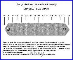NEUF AUTHENTIQUE bracelet cristal point croisé métal liquide Sergio Gutierrez RTB21